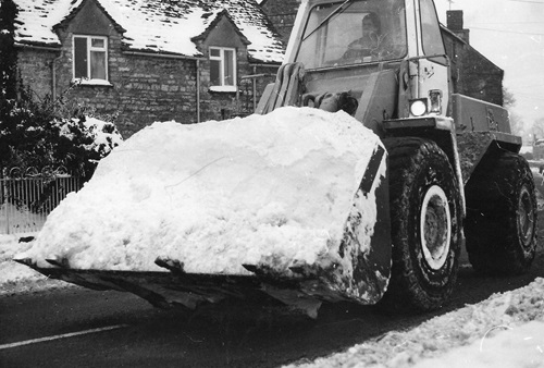 Large digger from local quarry in Shipton High Street